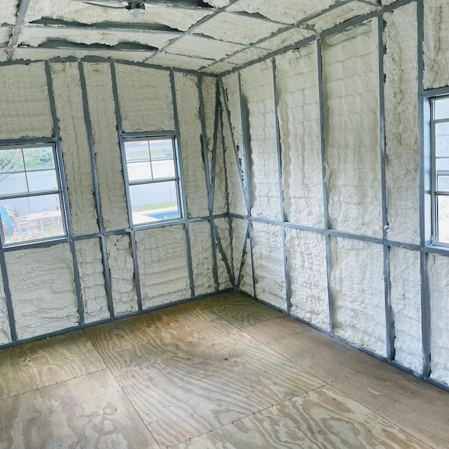 Closed-cell spray foam insulation applied to wall cavities in a residential project in Butner